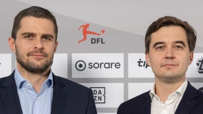 Marc Lenz (l.) und Steffen Merkel: Rekordzahlen beim Wirtschaftsreport der DFL. (Foto: Jürgen Kessler/dpa)