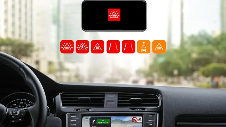 „Magic Earth“ im Carplay-Modus: Während das iPhone per Kamera die Umgebung im Blick behält und nur Warnungen auf seinem Display anzeigt, läuft die Navigation auf dem Bildschirm des Auto-Entertainmentsystems. (Foto: Magic Earth/dpa-tmn)