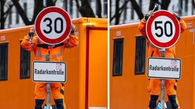 Die Mitarbeiter des Baureferats haben inzwischen eine gewisse Routine beim Schildwechsel an der Landshuter Allee. (Archivbild) (Foto: Peter Kneffel/dpa)