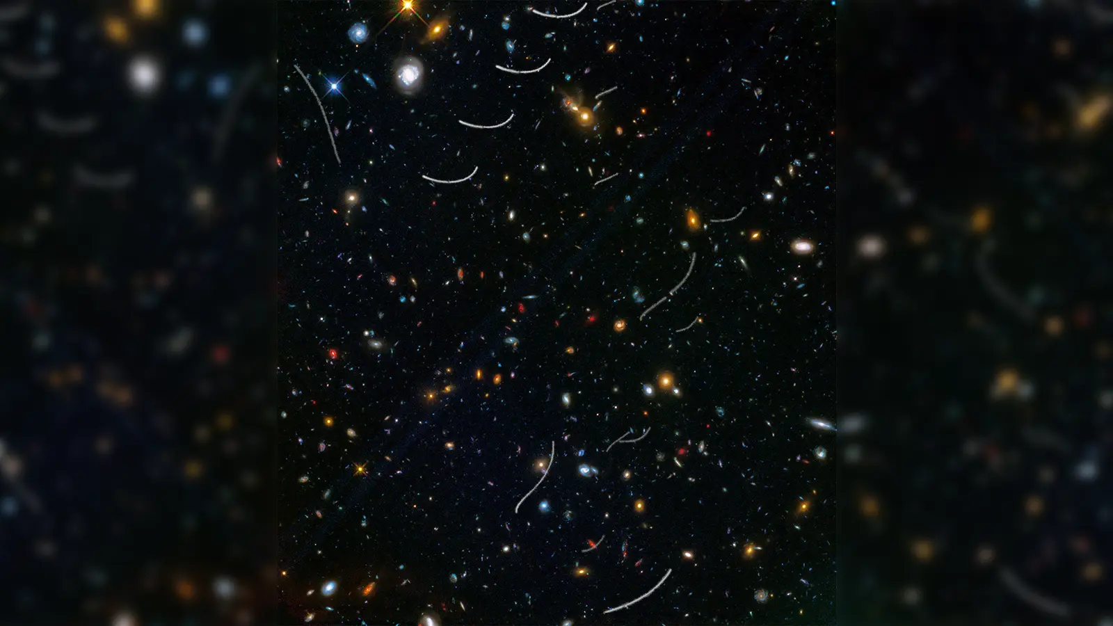 Für das Bild wurden Aufnahmen des Weltraumteleskops Hubble übereinander gelegt. Es zeigt die Bahnen mehrerer Asteroiden (weiße Linien). (Foto: NASA, ESA, and B. Sunnquist and J. Mack (STScI)/Acknowledgment: NASA, ESA, and J. Lotz (STScI) and the HFF Team/dpa)