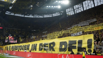 Dortmunds Fans protestieren mit einem Banner gegen Investoren in der DFL. (Foto: Bernd Thissen/dpa)