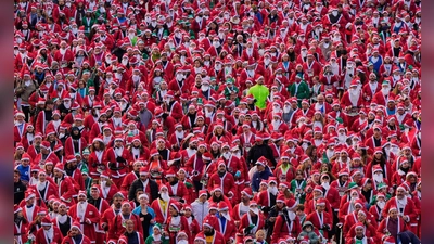 Starke Konkurrenz herrscht beim Weihnachtsmannrennen in Madrid. (Foto: Manu Fernandez/AP/dpa)
