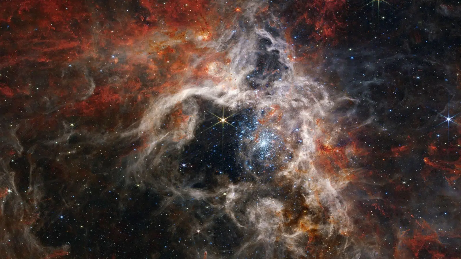 Dieses von der NASA veröffentlichte Bild zeigt die Sternentstehungsregion des Tarantula-Nebels, aufgenommen vom James Webb Space Telescope. (Foto: NASA, ESA, CSA, STScl, and Webb ERO Production Team/AP/dpa)