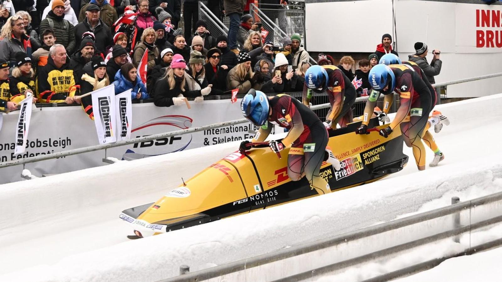 Felix Straub from Ansbach celebrates victory in the four-man bobsleigh ...