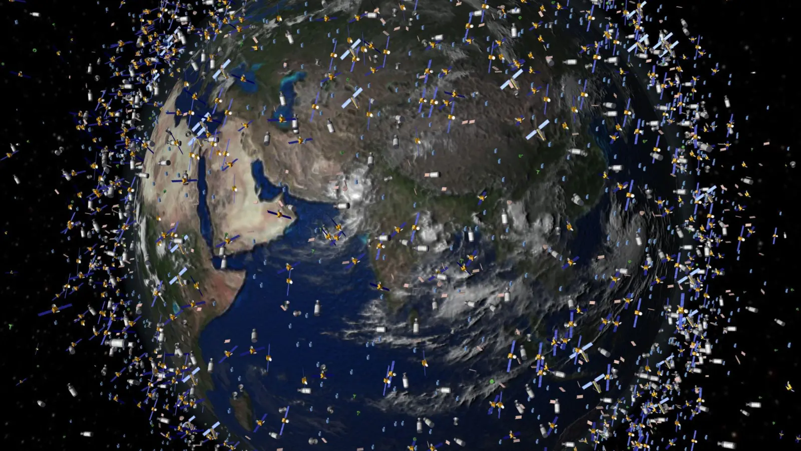 Das computergenerierte Bild der European Space Agency (ESA) zeigt Weltraummüll früherer Weltraummissionen, der neben intakten Satelliten um die Erde kreist. (Foto: ESA/ESA/dpa)