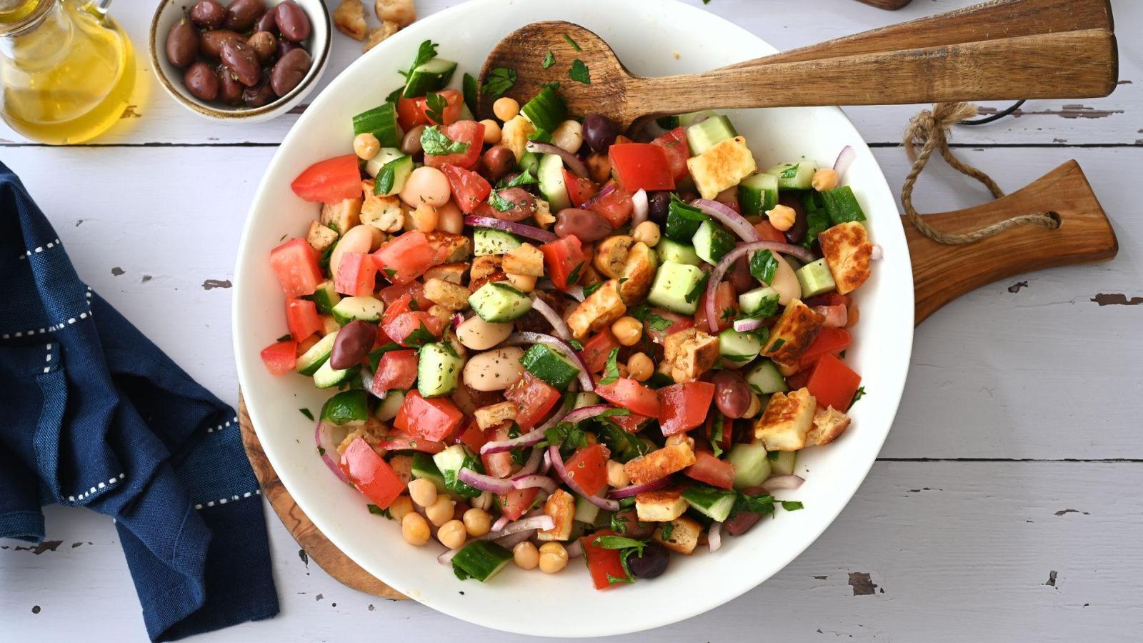 Greek salad with roasted halloumi and crispy pita